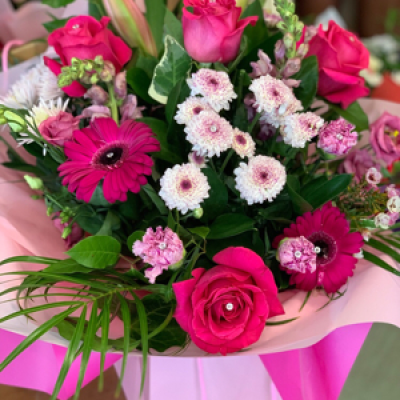Sparkly Pink - Seasonal pink flowers with added sparkle. Hand tied and in water